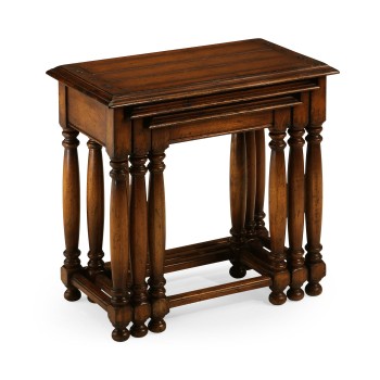 Nest of three walnut tables with plank tops