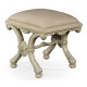 Heavily carved French provincial green x-frame footstool
