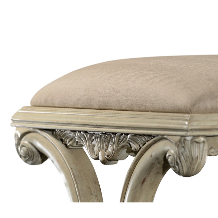 Heavily carved French provincial green x-frame footstool