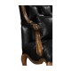 Wing-backed chair in black leather